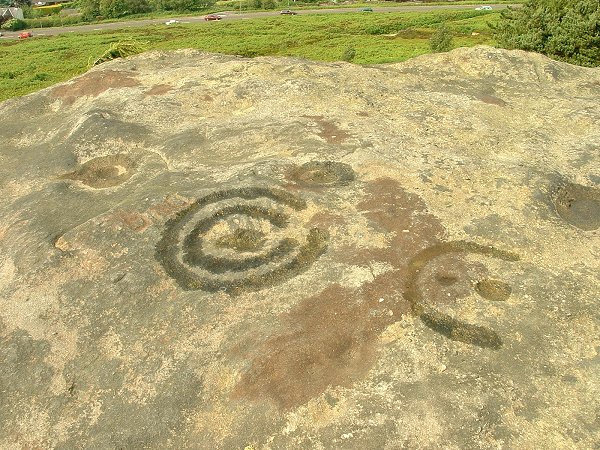 Hanging Stones (Cup and Ring Marks / Rock Art) by Chris Collyer